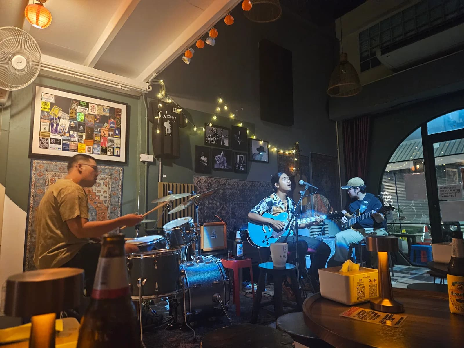 A three-piece band playing in a small bar in Chiang Mai