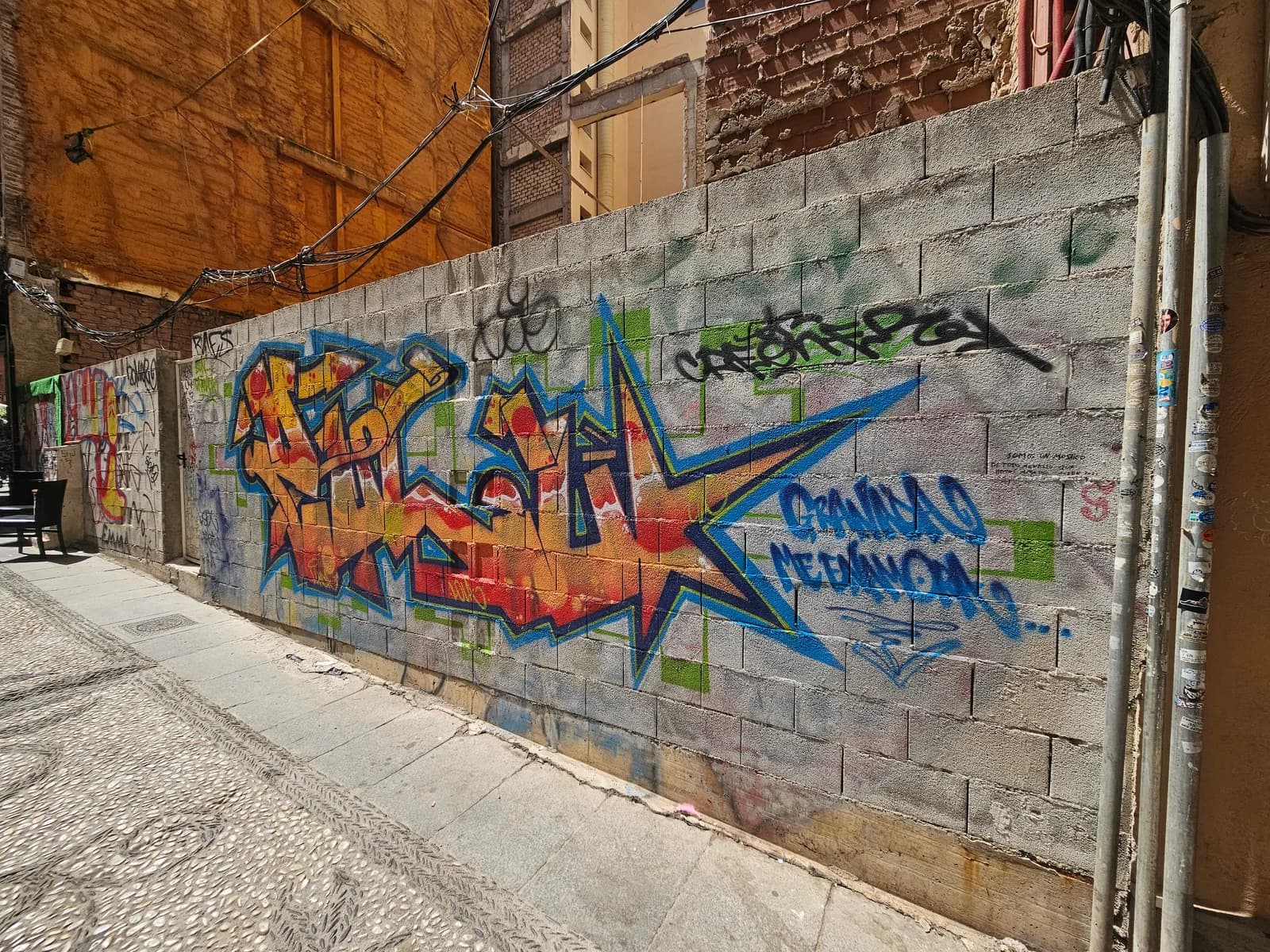 A graffiti star sprayed on a breeze-block wall in Valencia